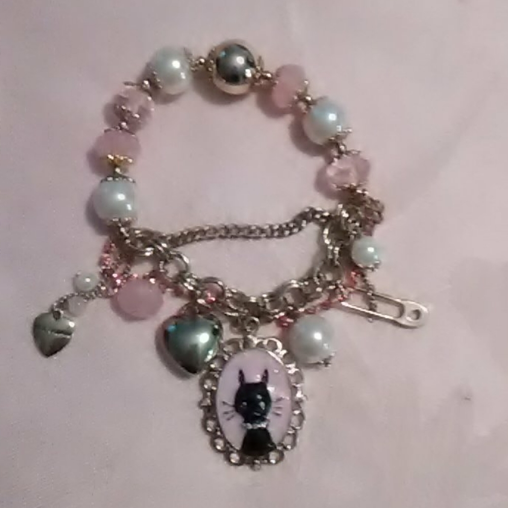 Adorable Betsey Johnson pink and gold cat bracelet